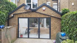 Custom arched window with decorative detailing in a historic home in North London