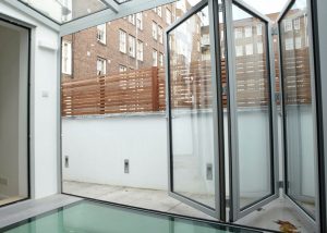 ontemporary black steel windows on an industrial-style property in Brent