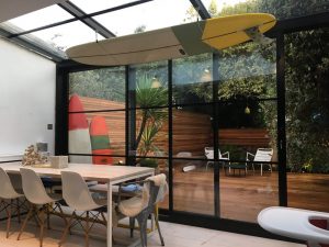 ontemporary black steel windows on an industrial-style property in Brent